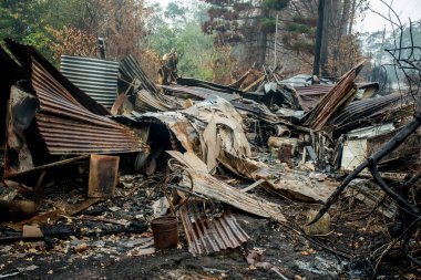 Australian bushfire aftermath: Burnt building ruins and rubble at Blue Mountains, Australia clipart