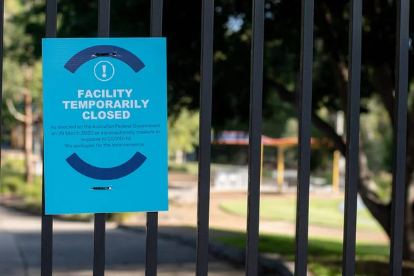 Closure sign on a fence of public park in Australia closed down due to COVID-19 pandemic.