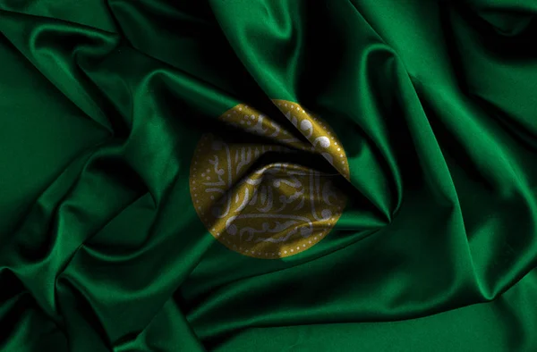 Rohingya flag waving in the wind. Flag of the Rohingya as a patriotic background. Closeup.
