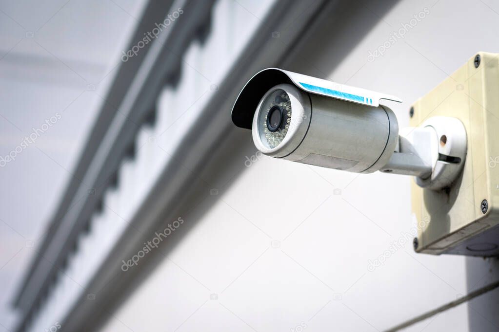 CCTV Security camera on building wall.