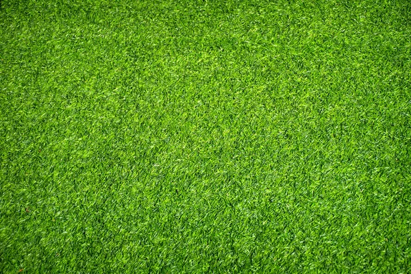 Erba verde artificiale texture sfondo. — Foto Stock