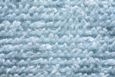 Açık mavi havlu dokusu arkaplanının makro fotoğrafı.