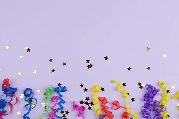 Festive party border or frame of colorful spiral streamers and confetti on pink background — 스톡 사진