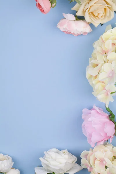 Various different flowers with vivid colours on blue background. — 스톡 사진