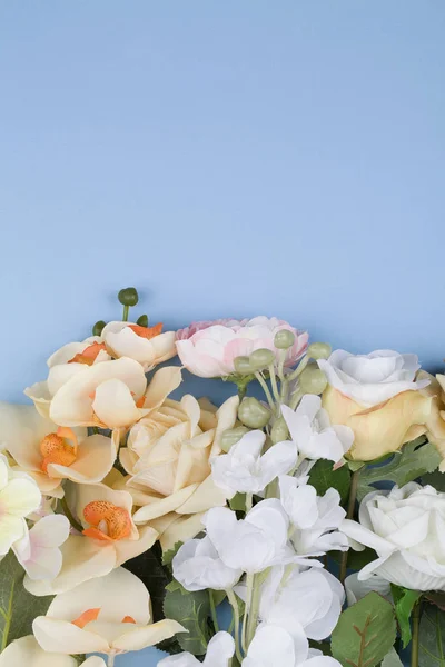 Various different flowers with vivid colours on blue background. — 스톡 사진