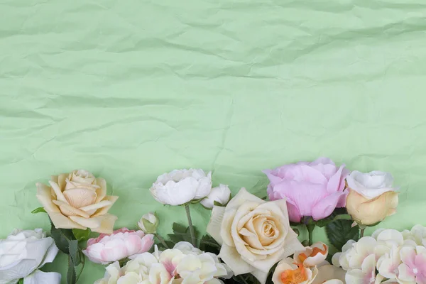 Various different flowers with vivid colours on rumpled green background. — 스톡 사진