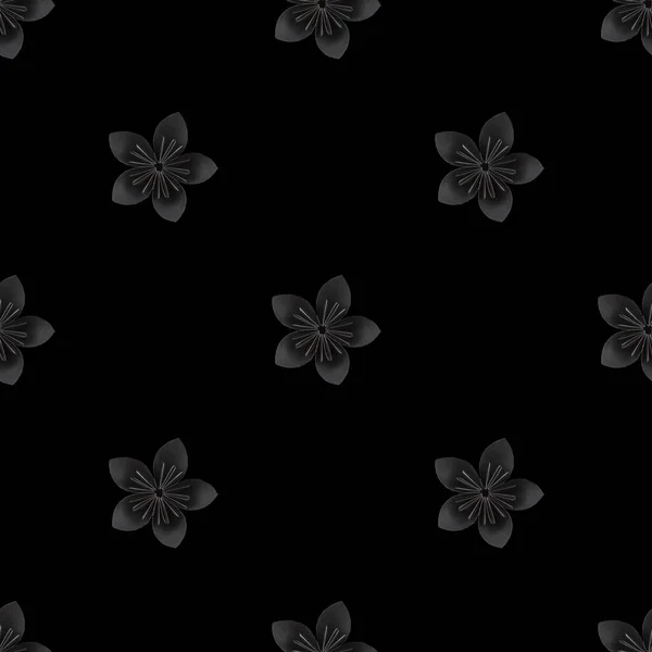 pattern with black paper flower on black background. Flat lay, top view, view from above. Photographic collage and seamless pattern