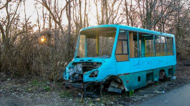 Skeleton of a body of a passenger minibus near the road
