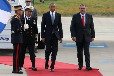 President Barack Obama arrives at the Athens clipart