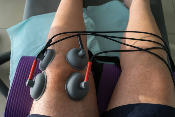 suction cups applied to a knee in physiotherapy