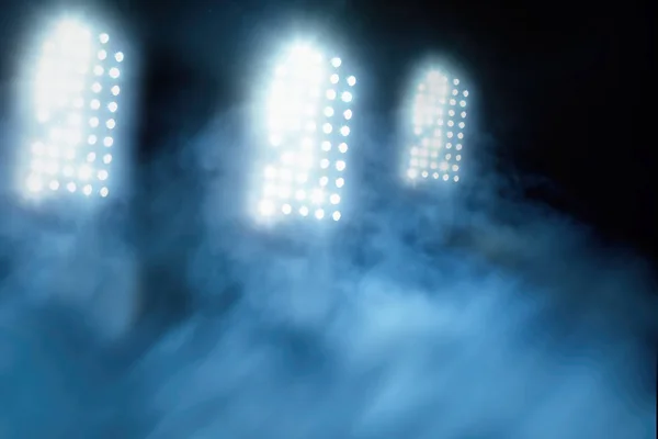 stadium lights and smoke