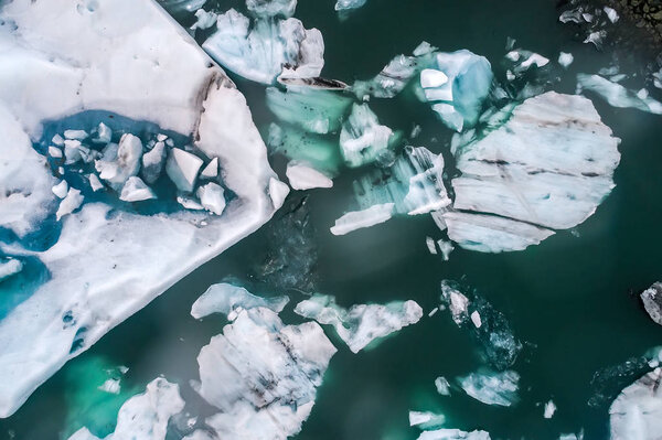 Aerial view of icebergs floating in Jokulsarlon Lagoon by the so