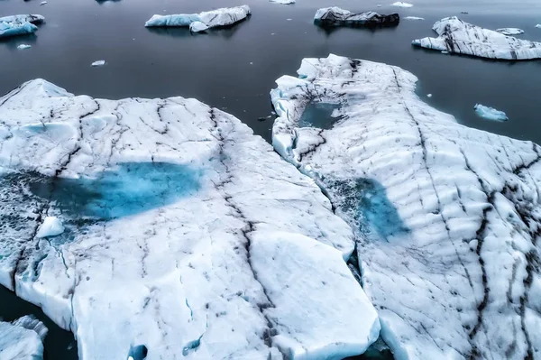 Aerial view of icebergs floating in Jokulsarlon Lagoon by the so