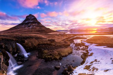 Spring sunrise over the famous Kirkjufellsfoss Waterfall with Ki clipart