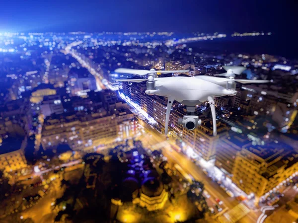 Drone flying over Thessaloniki city on blurred background. — Stock Photo, Image