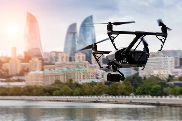 Drone flying over Baku city on blurred background. — Stock Photo, Image