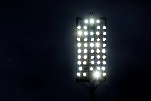 Stadium lights against dark night sky background — Stock Photo, Image