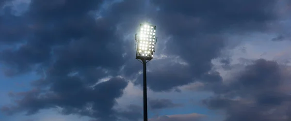 Stadium lights against dark night sky background — Stock Photo, Image