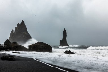 Stormy Weather at Reynisfjara Volcanic Beach clipart