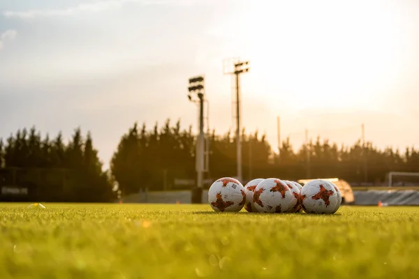 Football balls on the pitch — Stock Photo, Image