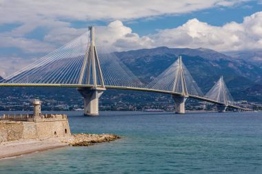 View of suspension bridge Rio-Antirio in Greece. Bridge crossing Corinth Gulf strait, Peloponnese, Greece clipart