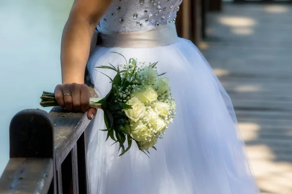 Close view of beautiful colorful wedding bouquet in a hand of a — Stock Photo, Image