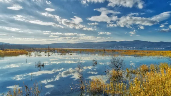 Reflection of clouds at the wetland of Lake Doriani on a winter — Stock Photo, Image