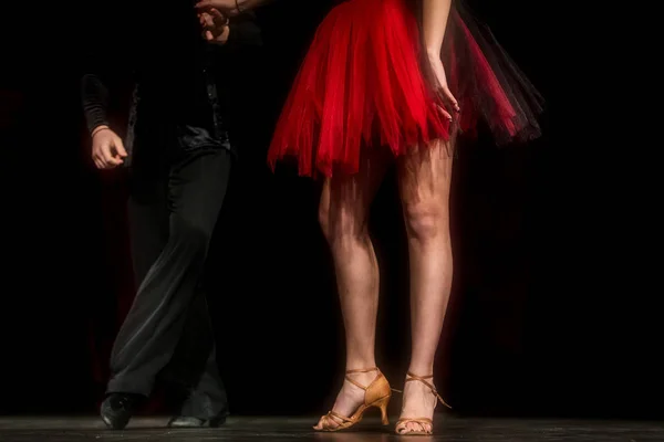 Legs of young dancers on the dance floor — Stock Photo, Image