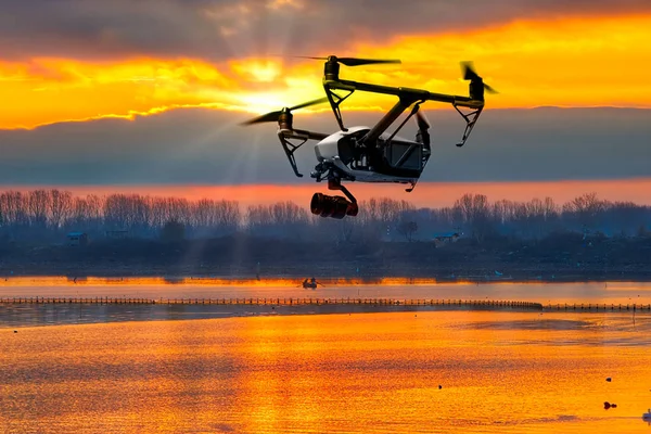 Modern drone watching the beautiful sunset — Stock Photo, Image