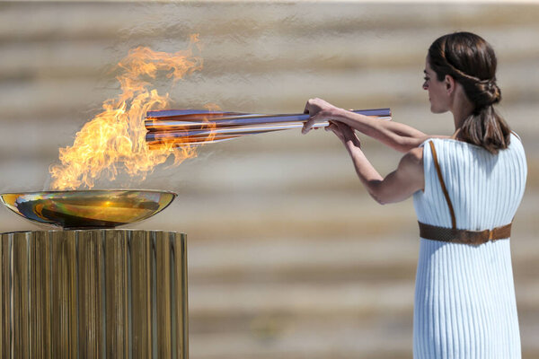 Athens, Greece - March 19, 2020: Olympic Flame handover ceremony for the Tokyo 2020 Summer Olympic Games at the Panathenaic Kallimarmaro Stadium