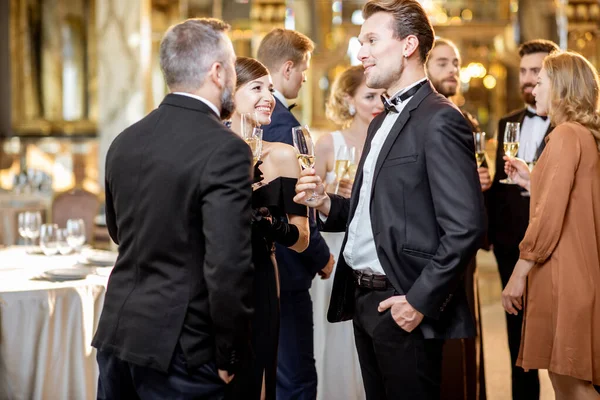 Elegant people during a celebration indoors — ストック写真