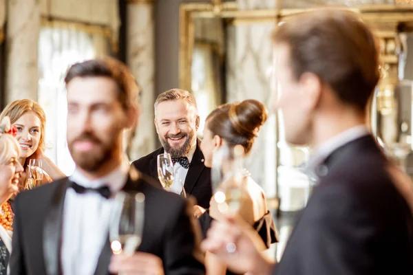 Elegant people during a celebration indoors — Stock Photo, Image
