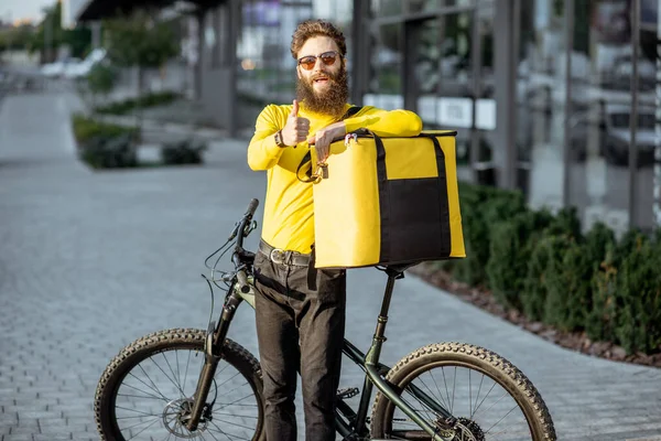 Courier portrait with bicycle and bag outdoors — Stock Photo, Image