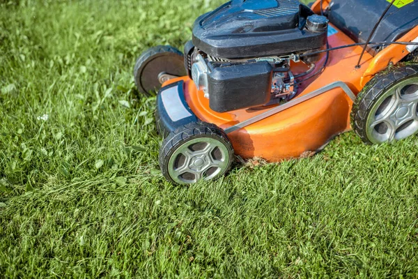 Lawn mower cutting grass — Stock Photo, Image