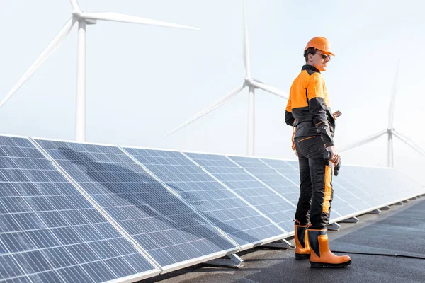 Well-equipped workman on a solar station — Stock Photo, Image