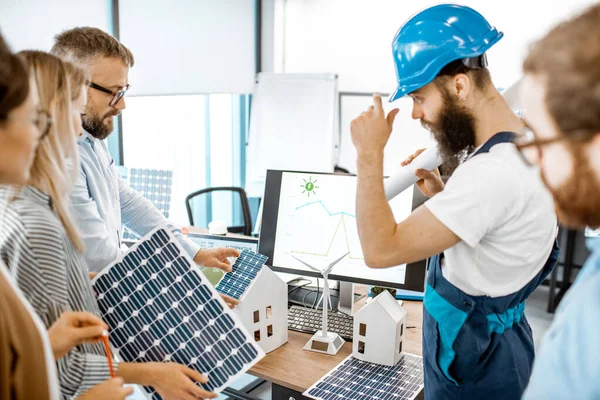 People working on alternative energy project in the office — Stock Photo, Image