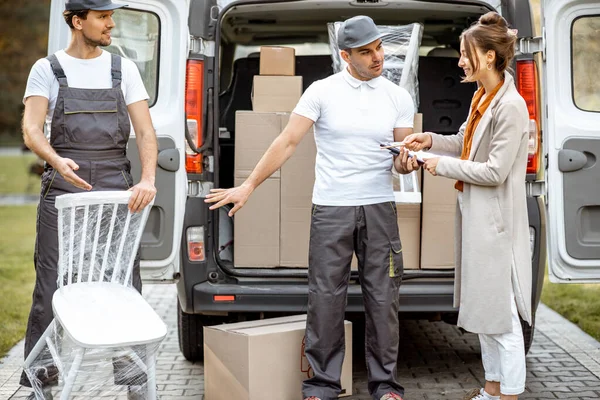 Movers delivering goods during a relocation — ストック写真