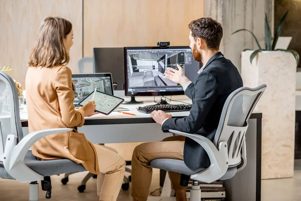 Two interior designers working in the office