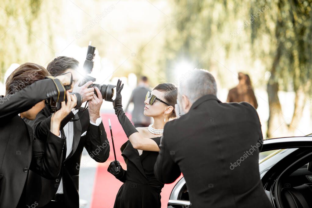 Photo reporters photographing actress ariving on the awards ceremony