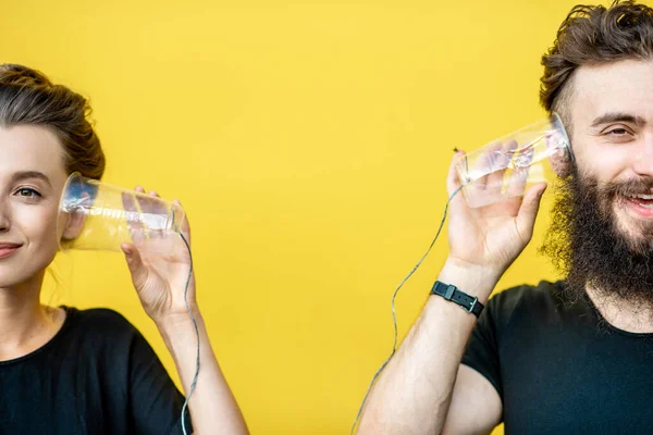 Man and woman talking with string phone — Stock Photo, Image