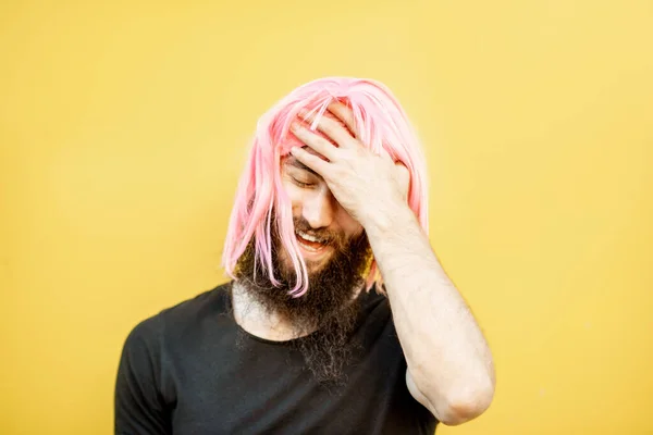 Man with color hair on the yellow background