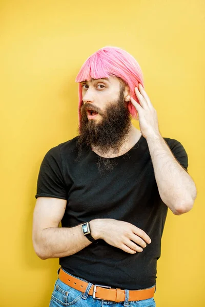 Man with color hair on the yellow background