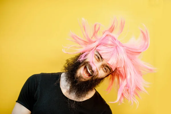 Man with color hair on the yellow background