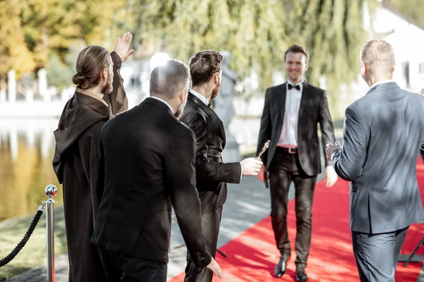 Movie actors on the red carpet outdoors — Stock Photo, Image