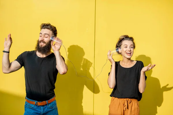 Man and woman talking with string phone — Stock Photo, Image