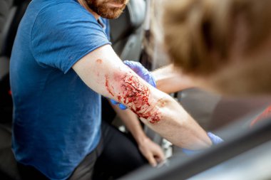 Medic examining victim after the accident