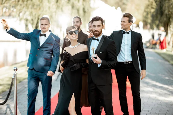 Movie actors on the red carpet outdoors — Stock Photo, Image