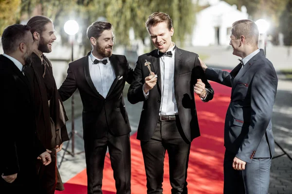 Movie actors on the red carpet outdoors — Stock Photo, Image