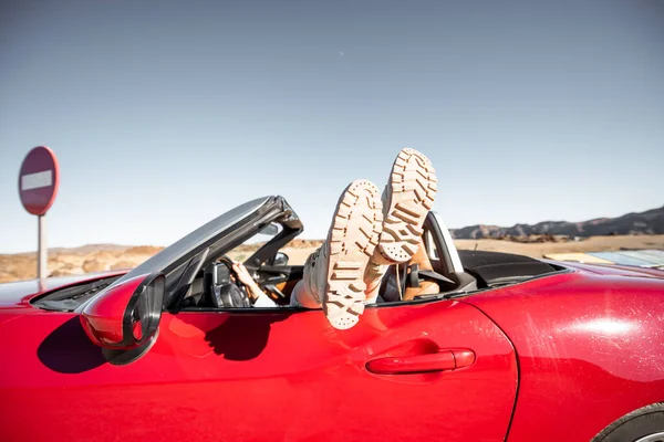 Woman traveling on converrtible sports car — Zdjęcie stockowe