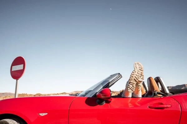 Woman traveling on converrtible sports car — Zdjęcie stockowe